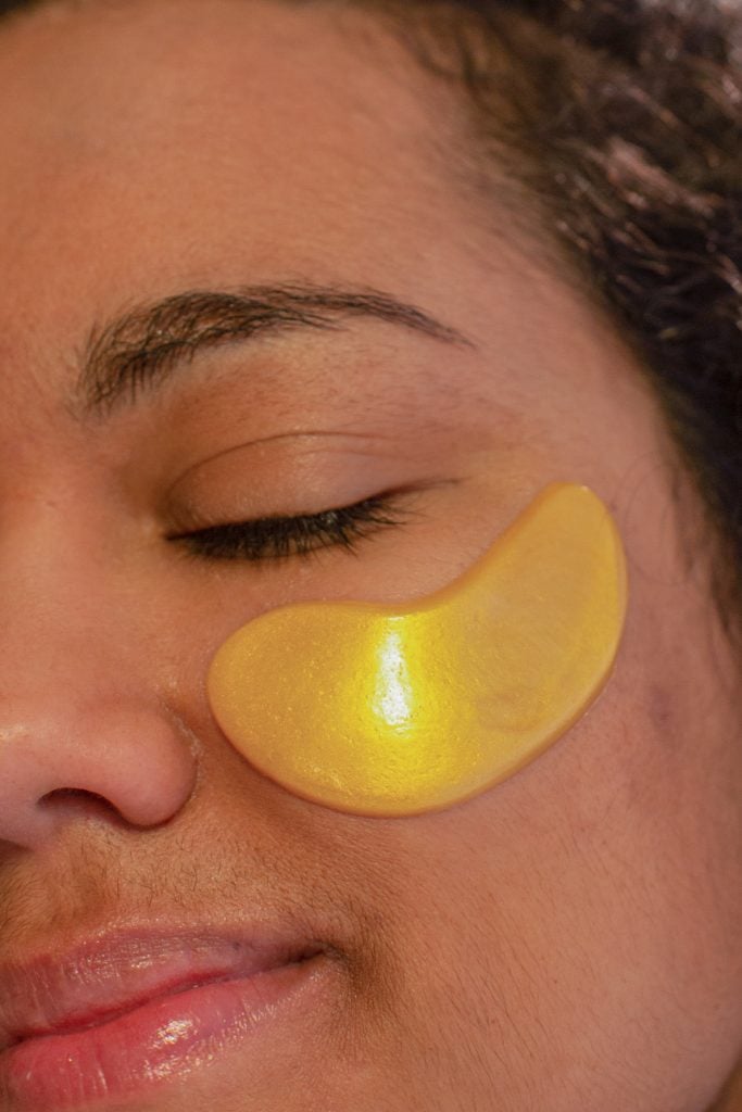 woman with moisturizing eye patch on face