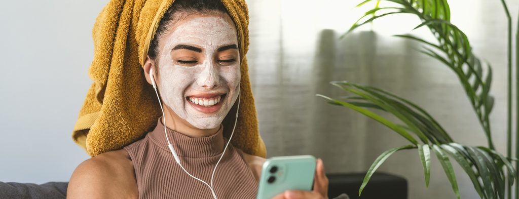 Woman with mask on phone