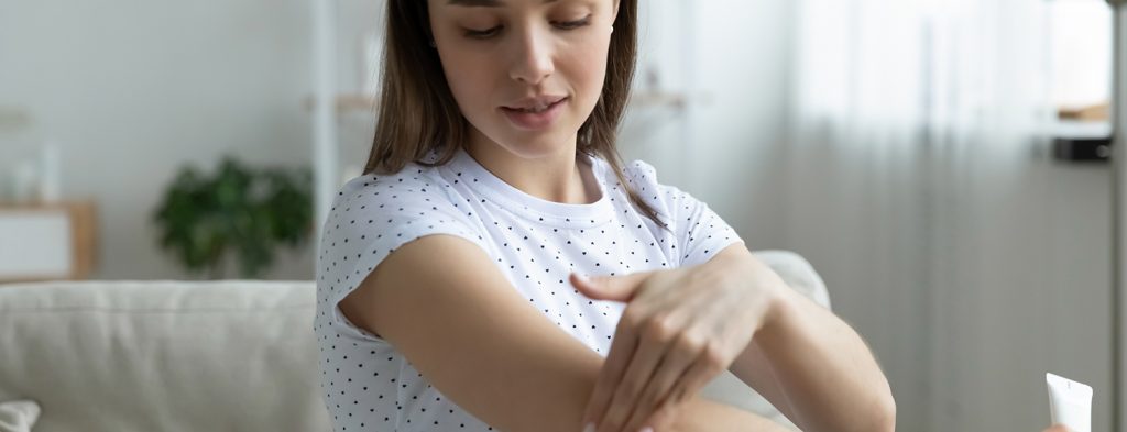 Woman applying cream